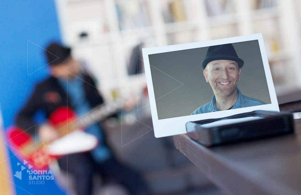 Concept Portrait of musician in foreground with out of focus image of him in the background